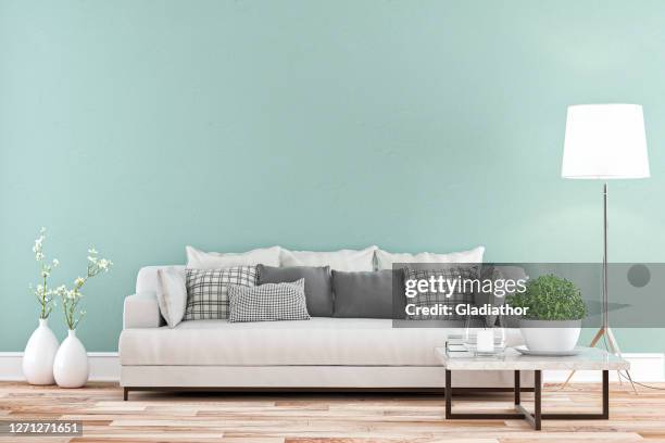 elegant living room with sofa whole view - colored wall background - mint green stock pictures, royalty-free photos & images