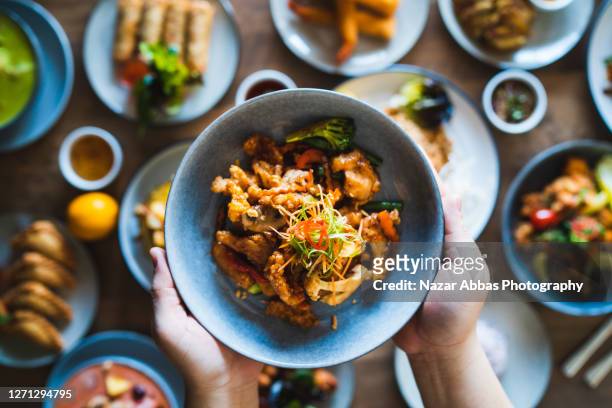 spicy thai fried pork. - asian food stock pictures, royalty-free photos & images