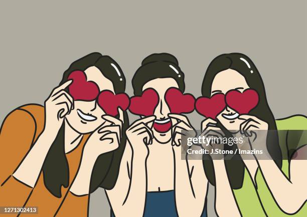 three women covering eyes with hearts - blindfold stock illustrations