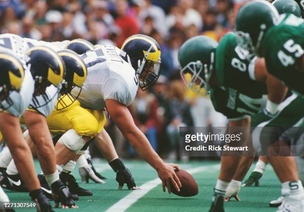 Steve Everitt, Center for the University of Michigan Wolverines calls the play at the snap during the NCAA Division I-A Big 10 college football game...