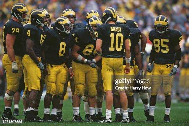 Tom Brady Quarterback for the University of Michigan Wolverines instructs his offensive line in the huddle during the NCAA Division I-A Big 10...