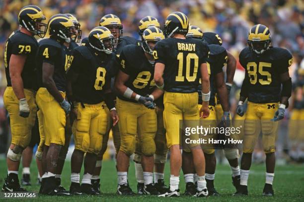 Tom Brady Quarterback for the University of Michigan Wolverines instructs his offensive line in the huddle during the NCAA Division I-A Big 10...