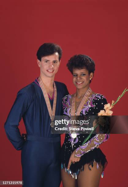 Brian Boitano and Debi Thomas of the United States celebrate winning gold in the Men's and Ladies Figure Skating Singles competitions during the ISU...