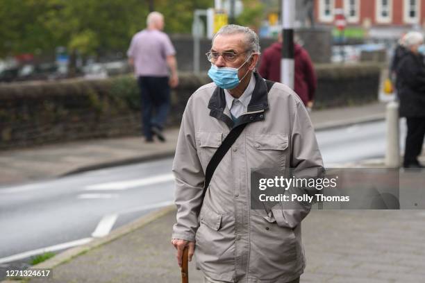 Man wearing a face mask with his nose uncovered in the town centre on September 08, 2020 in Caerphilly, United Kingdom. The county borough of...