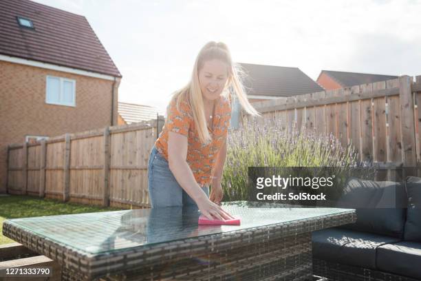 tidying up outdoors - outdoor furniture stock pictures, royalty-free photos & images