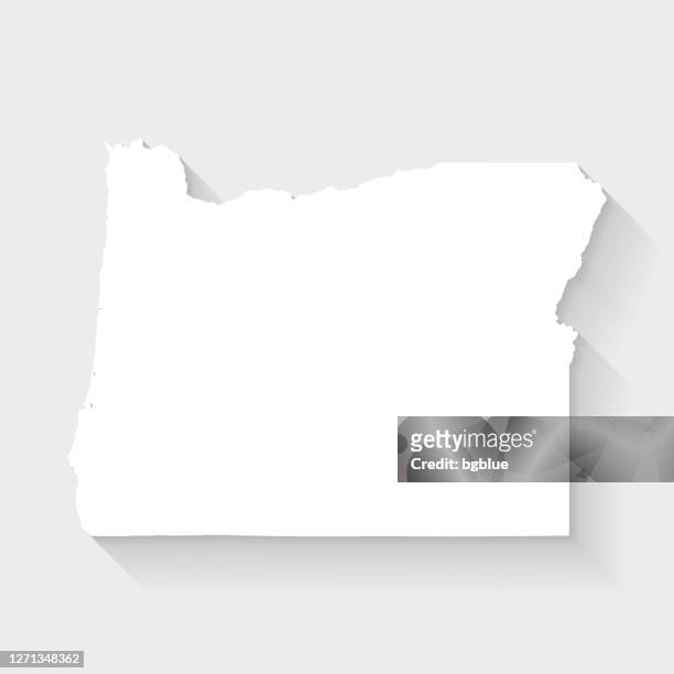 oregon map with long shadow on blank background - flat design - oregon us state stock illustrations
