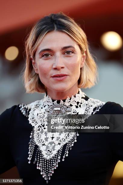 Festival Hostess Anna Foglietta walks the red carpet ahead of the movie "Notturno" at the 77th Venice Film Festival on September 08, 2020 in Venice,...