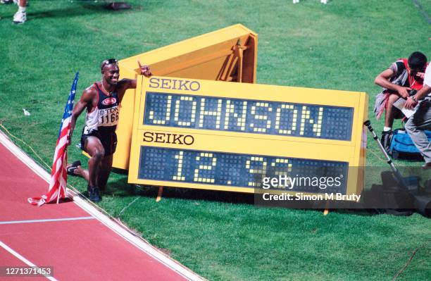 Allen Johnson of the United States of America celebrates winning the men's 110m Hurdle Final at The 6th IAAF World Athletics Championships at the...