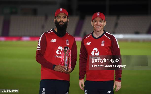 Moeen Ali of England and Eoin Morgan of England pose with the trophy after winning the series 2-1 during the 3rd Vitality International Twenty20...