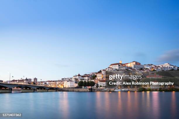 downtown coimbra seen across the mondego river - coimbra stock pictures, royalty-free photos & images