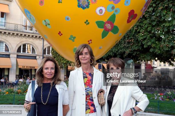 Eleonore de la Rochefoucauld, Rose de Ganay and Yagel Didier attend "Bouquet du Coeur" Sculpture By Rose De Ganay unveiling At Place du Louvre on...