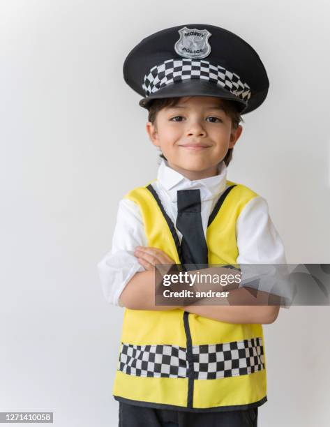 happy boy dressed as a police officer - police uniform stock pictures, royalty-free photos & images