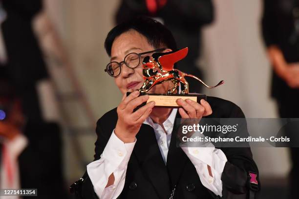 Director Ann Hui poses on the red carpet with the Golden Lion Lifetime achievement award attends the Golden Lion For Lifetime Achivement Award...