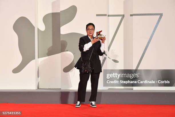 Director Ann Hui poses on the red carpet with the Golden Lion Lifetime achievement award attends the Golden Lion For Lifetime Achivement Award...
