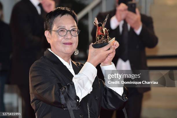 Ann Hui poses with her the Golden Lion For Lifetime Achivement Award Ceremony at the 77th Venice Film Festival on September 08, 2020 in Venice, Italy.