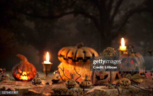 spooky pumpkin jack o' lantern background - candlestick holder stock pictures, royalty-free photos & images