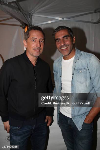 Actors Gad Elmaleh and Ary Abittan attend Doctor Roland Levy bids farewell to his "Stars of Patients" on September 08, 2020 in Paris, France.