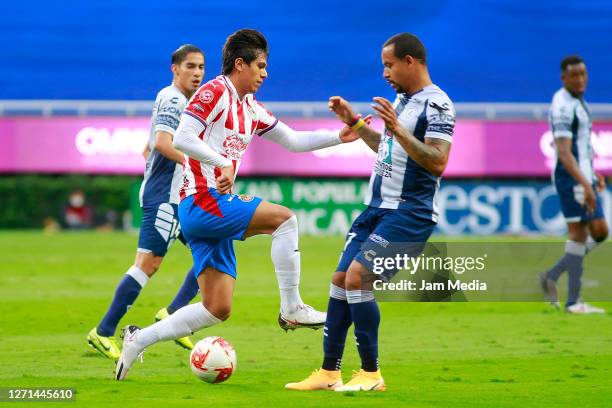 Jose Juan Macias of Chivas fights for the ball Felipe Pardo of Queretaro during the 9th round match between Chivas and Queretaro as part of the...