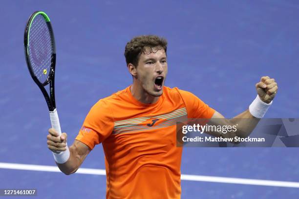 Pablo Carreno Busta of Spain reacts to winning match point during his Men’s Singles quarter finals-match against Denis Shapovalov of Canada on Day...