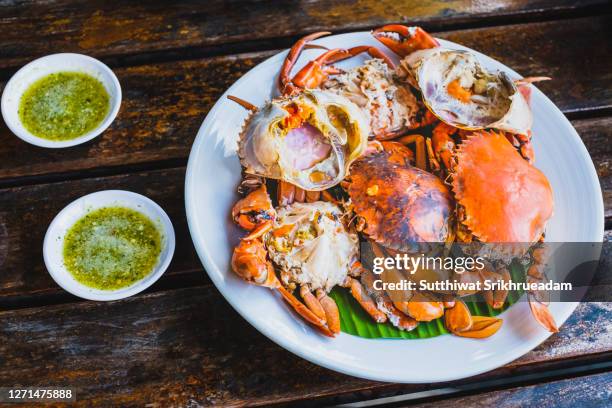 high angle view of steamed egg crab with spicy sauce, thailand seafood - chilli crab stock pictures, royalty-free photos & images