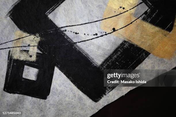 echizen washi paper - black and gold brush stroke square frame on japanese washi paper,hand painting style using sumi ink - traditional japanese painting stock pictures, royalty-free photos & images