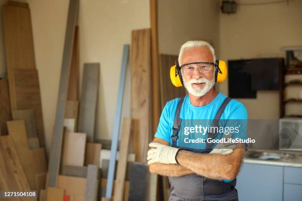 confident worker - earmuff stock pictures, royalty-free photos & images