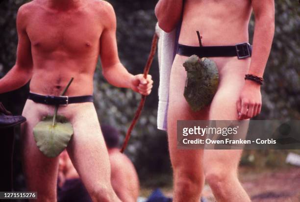 Two naked men with leaves covering their genitals attend Woodstock Music Festival, Bethel, New York, 15th-18th August 1969.