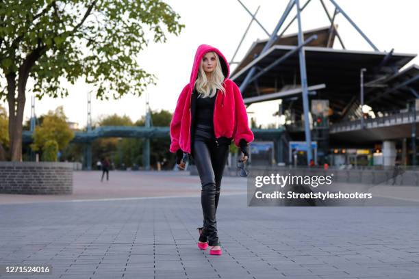 German Model Anna Hiltrop wearing black faux leather pants by Zara, a black body by Off White, a pink fuzzy faux fur bomber jacket by Karl Lagerfeld...