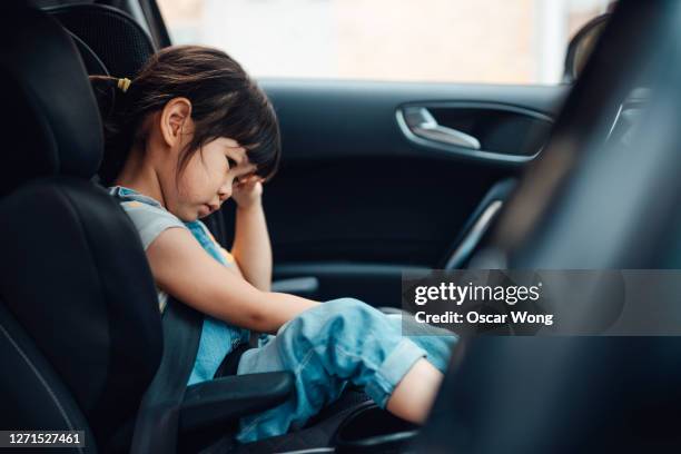 young girl feeling bored in car - kids inside car stock pictures, royalty-free photos & images