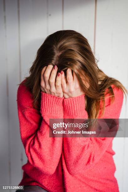 woman covering her face - woman head in hands sad stock pictures, royalty-free photos & images