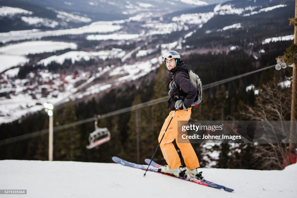 Skier at winter looking at camera