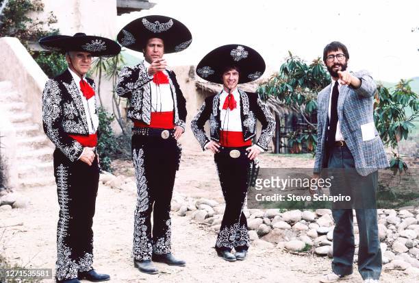 View of, from left, Steve Martin , Chevy Chase , and Martin Short , with director John Landis, on the set of 'Three Amigos,' Simi Valley, California,...