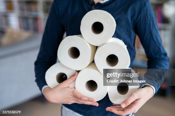 person holding toiler paper rolls - no toilet paper stock pictures, royalty-free photos & images