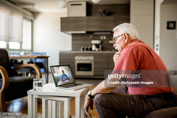 senior man on online therapy - doctor male laptop stock pictures, royalty-free photos & images
