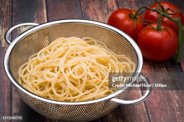 high angle view of food in bowl on table - escorredor imagens e fotografias de stock