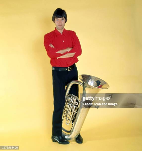 Dave Berry, the English pop singer and former teen idol of the 1960s, holding a euphonium in London, England, 1965.