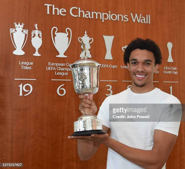 Trent Alexander-Arnold of Liverpool poses with the PFA Young Player of the Year Award at Melwood training ground on September 09, 2020 in Liverpool,...
