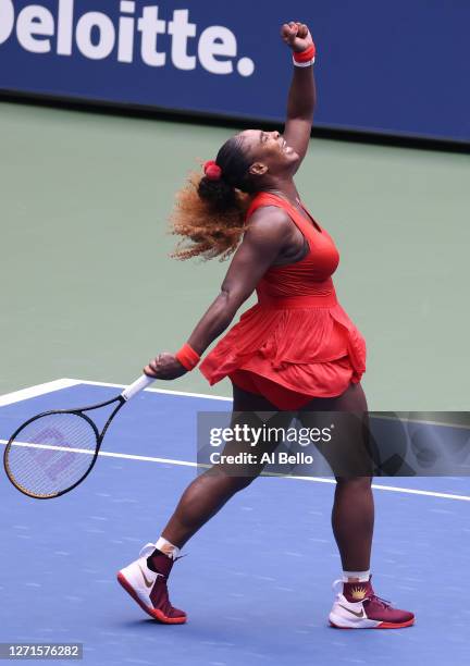 Serena Williams of the United States reacts to breaking Tsvetana Pironkova of Bulgaria in the second set during her Women's Singles quarterfinal...