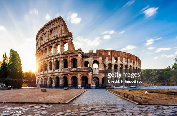 colosseum in rome during sunrise - colosseum stock pictures, royalty-free photos & images