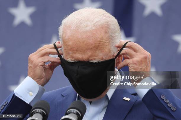 Democratic presidential nominee and former Vice President Joe Biden replaces the mask he wears to reduce the risk posed by coronavirus after...