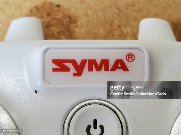 Close-up of logo for drone manufacturer Syma on drone remote control unit, San Ramon, California, September 5, 2020.