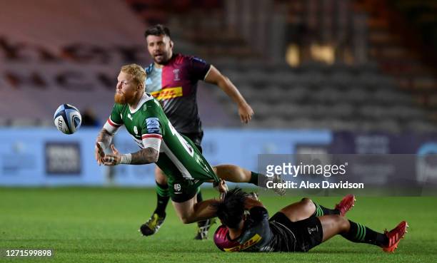 Tom Homer of London Irish is tackled by Marcus Smith of Harlequins during the Gallagher Premiership Rugby match between London Irish and Harlequins...