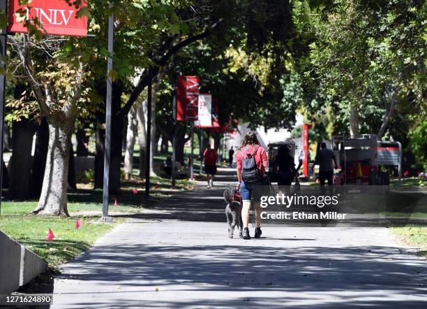 Student walks on campus after attending a class at UNLV amid the spread of the coronavirus on September 9, 2020 in Las Vegas, Nevada. To lower the...