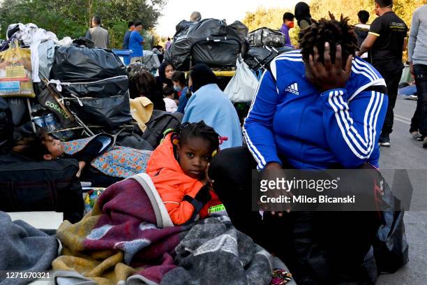 Refugees sleep on the road, close to Mytilene town, after a fire destroyed Moria Refugee Camp on the island of Lesbos on September 10, 2020 in...