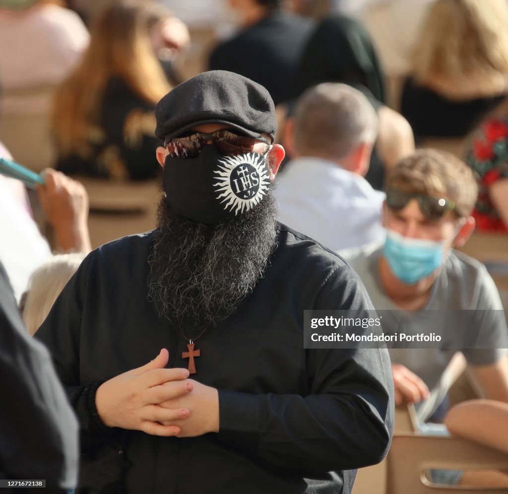 Pope With Mask A priest with dark glasses and protective mask bearing the IHS... News ...