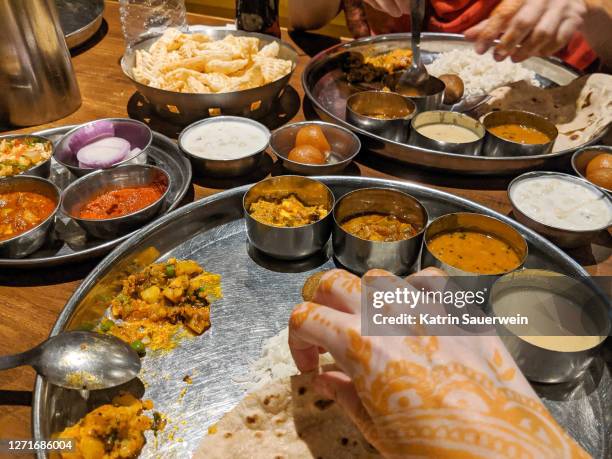 Indian Hands Food Photos and Premium High Res Pictures - Getty Images