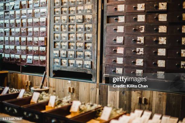 traditional chinese medicine cabinet - chinese herbal medicine stock pictures, royalty-free photos & images