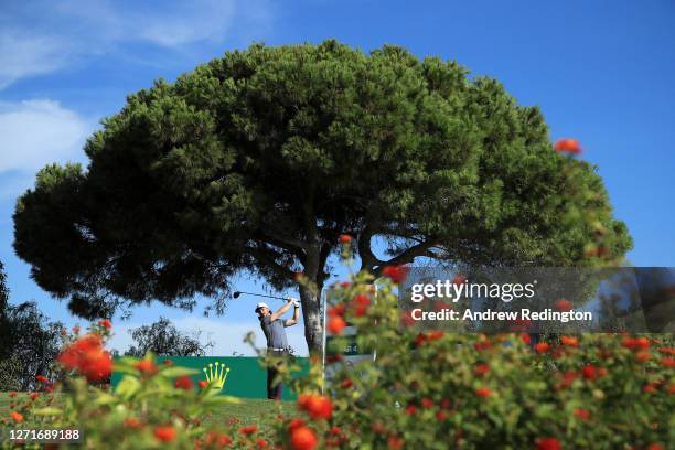 Tommy Fleetwood of England plays his shot off the 9th tee during Day One of the Portugal Masters at Dom Pedro Victoria Golf Course on September 10,...