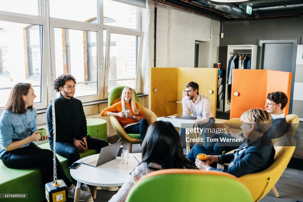 Group Of Employees Brainstorming During Seminar