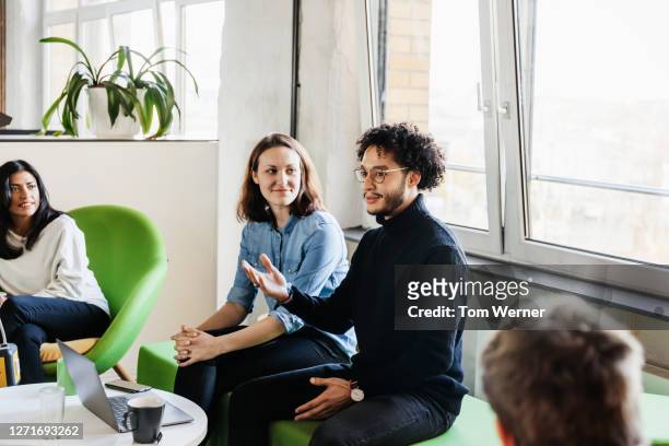 man talking during business meeting in office with colleagues - leadership listening stock pictures, royalty-free photos & images